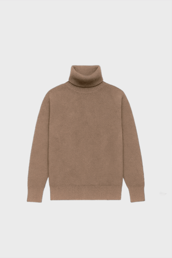 A brown turtleneck sweater with a relaxed fit, featuring a textured knit material, laid against a backdrop of a vintage map.