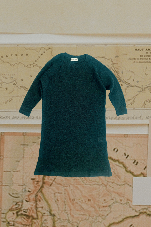 A dark green knit dress with long sleeves is displayed against a vintage map background. The dress has a simple, straight design and a visible label at the neckline.