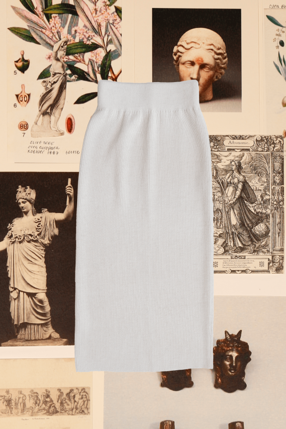 A light gray ribbed knit pencil skirt is displayed against a backdrop of classical art prints featuring sculptures and botanical illustrations.