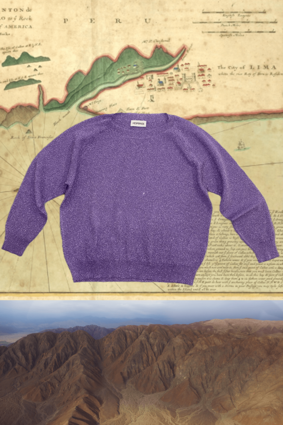 A purple, long-sleeve, loose-fit sweater with a textured knit material, labeled 
