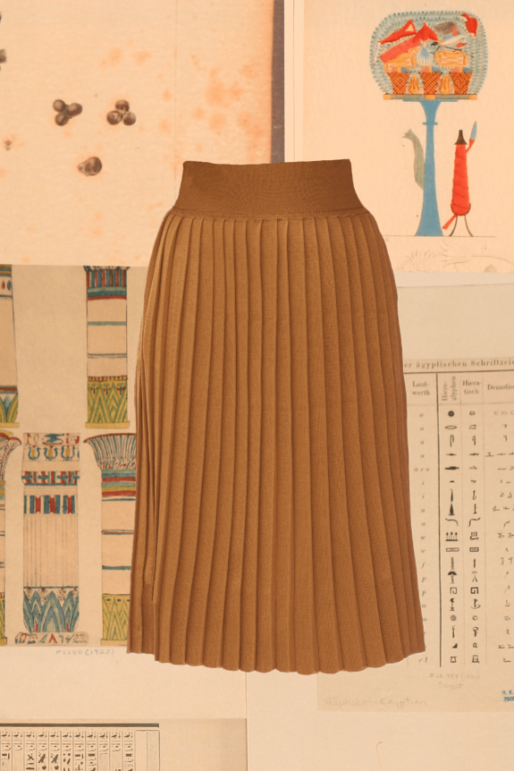 A brown pleated skirt with a fitted waistband, displayed against a background of Egyptian-style art illustrations.