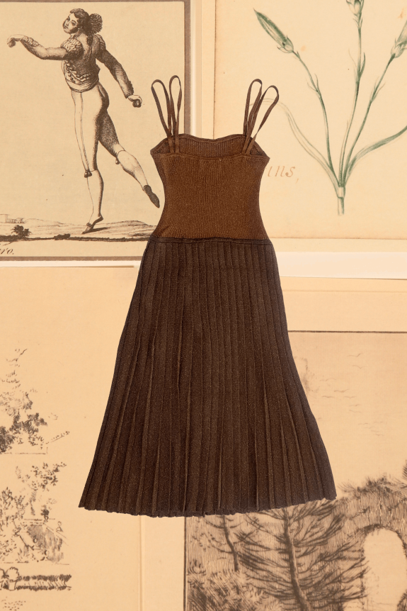 A brown, pleated knit dress with a fitted bodice and multiple shoulder straps, set against a background of vintage illustrations.