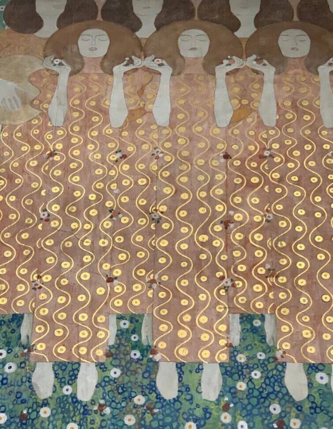 The image depicts an artwork showing stylized figures in flowing, patterned golden robes with swirling motifs, standing on a floral-patterned green and blue background.
