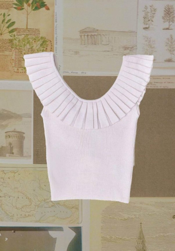 A white ribbed sleeveless top with a pleated, ruffled neckline, displayed against a collage of vintage sketches and maps.
