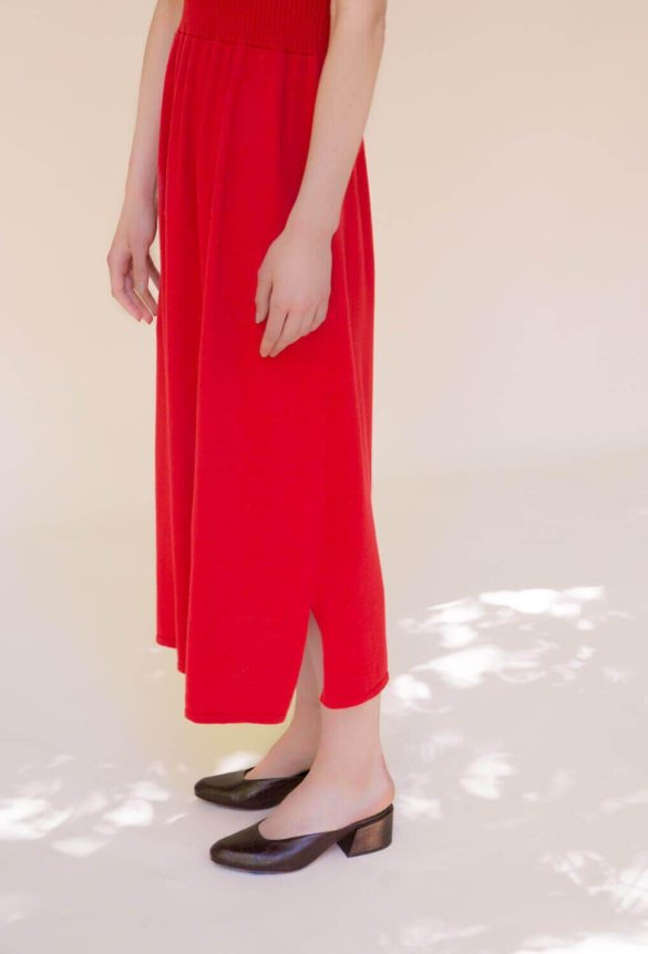 A fitted red ribbed knit dress with thin spaghetti straps.