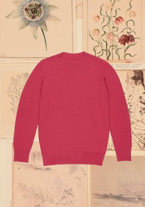 A black, short-sleeved, turtleneck sweater with a fitted style, set against a vintage map and collage backdrop.