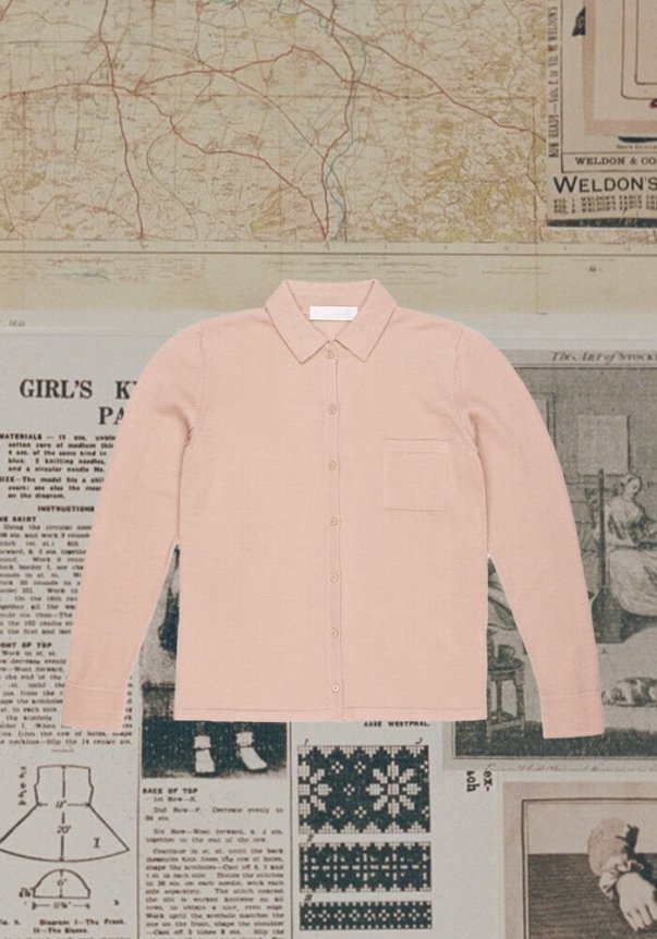 A light pink long-sleeve button-up shirt with a collar and chest pocket, set against a vintage map and newspaper background.
