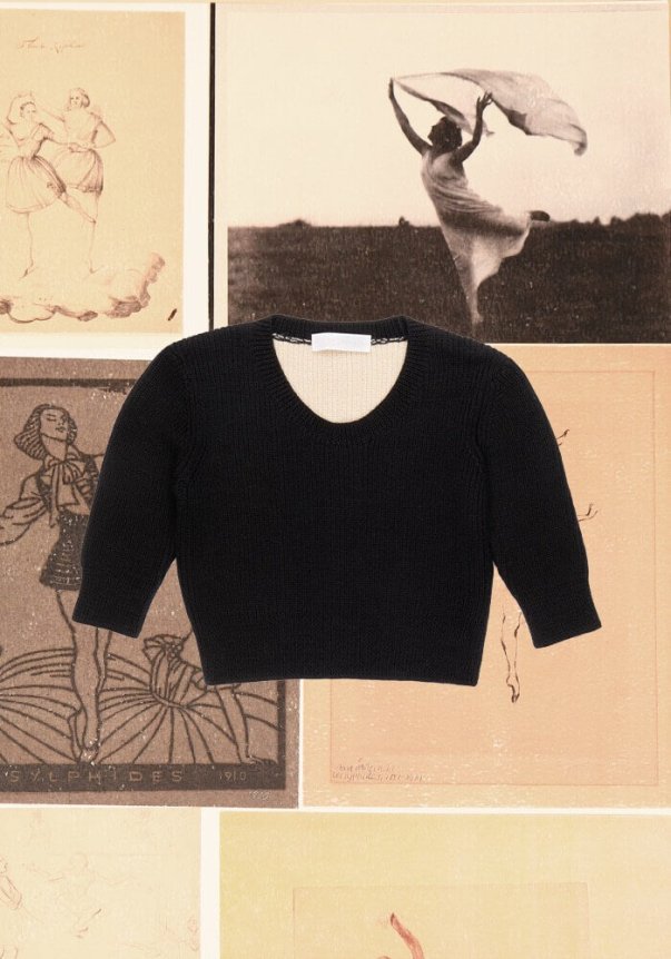 A black, fitted knit sweater with a crew neckline, laid on a background of vintage-style dance illustrations.