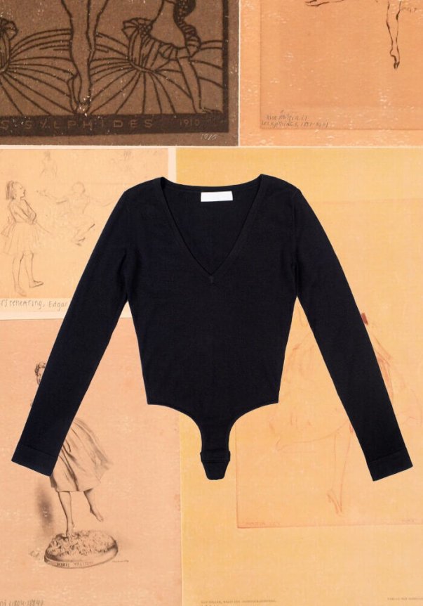A black, long-sleeve, V-neck bodysuit made from soft fabric, laid on a background featuring vintage ballet sketches and illustrations.