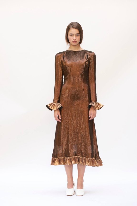 A bronze, long-sleeved, metallic midi dress with a fitted silhouette, featuring ruffled cuffs and hem.