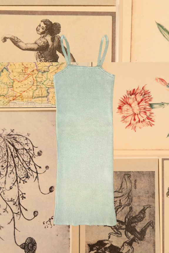 A pastel blue ribbed knit tank dress with spaghetti straps, set against a vintage collage background of maps and botanical illustrations.