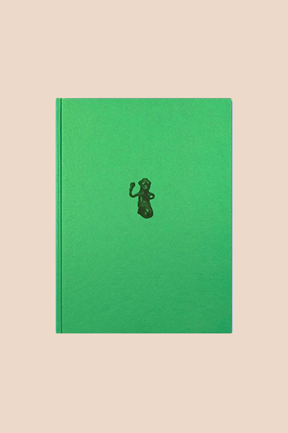 A green hardcover book with a small black illustration in the center.