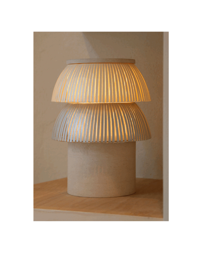 Hesperios modular sculptural lighting system crafted from paper, customizable geometric forms with pleated shades and stone or paper bases.