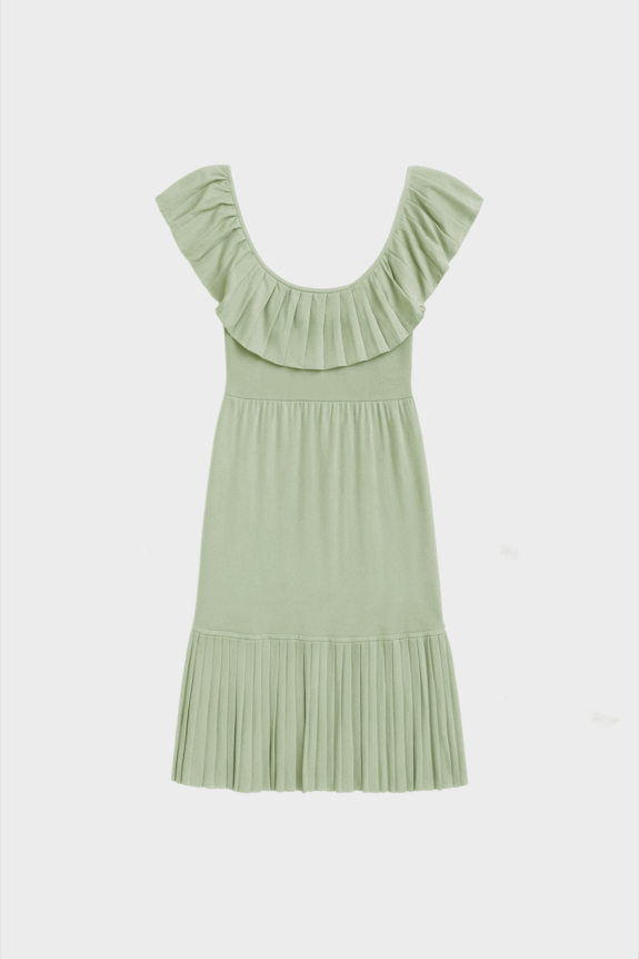 A light green dress with ruffled sleeves and a pleated hem.