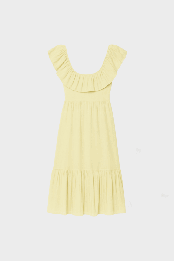 A light yellow dress with ruffled neckline and hem.