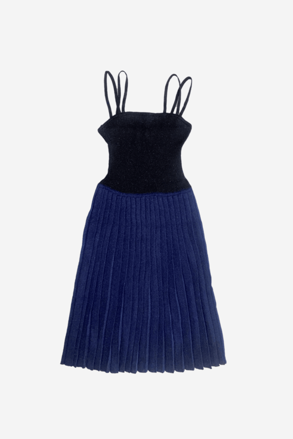 A black and navy blue pleated dress with double spaghetti straps.