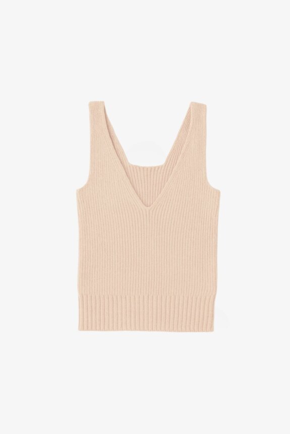A beige knitted sleeveless V-neck top.