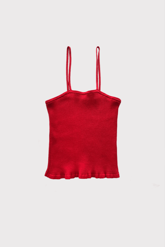 A red ribbed knit tank top with thin straps and a ruffled hem.