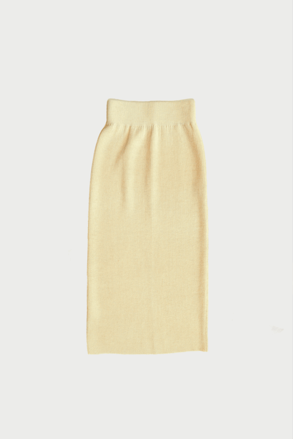 A light beige ribbed knit skirt on a white background.