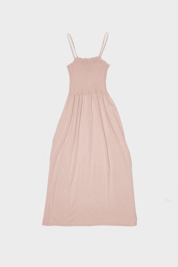A pink spaghetti strap maxi dress on a white background.