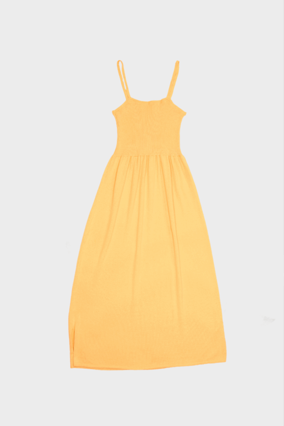 A yellow dress with spaghetti straps and a fitted bodice laid flat on a white background.