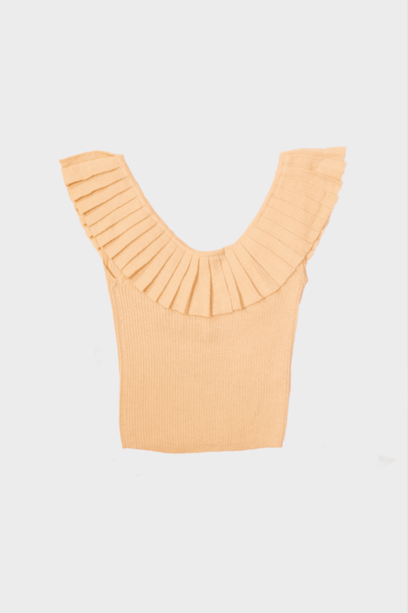 A beige sleeveless top with pleated shoulder details.