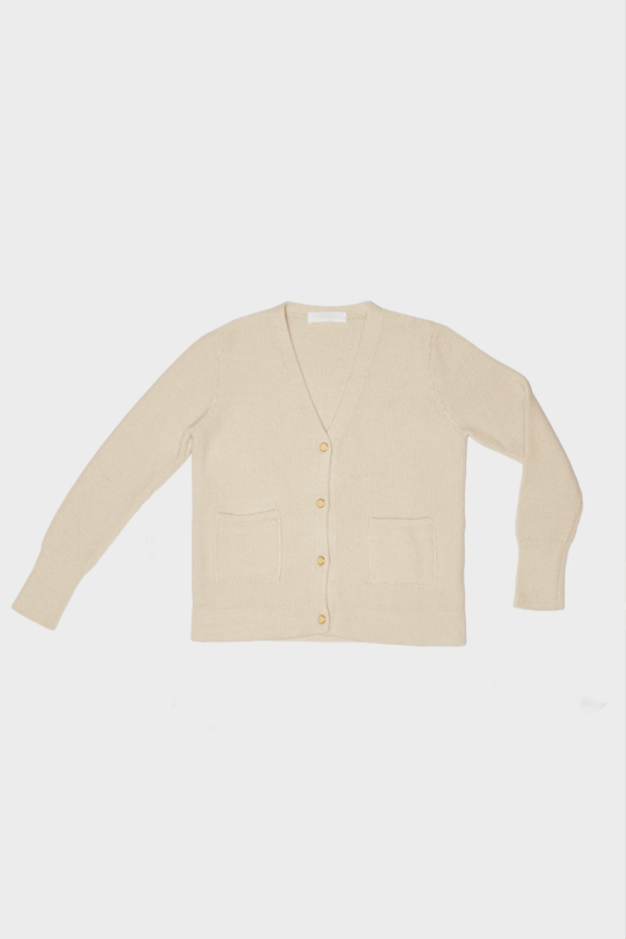A beige cardigan with buttons and front pockets displayed flat.