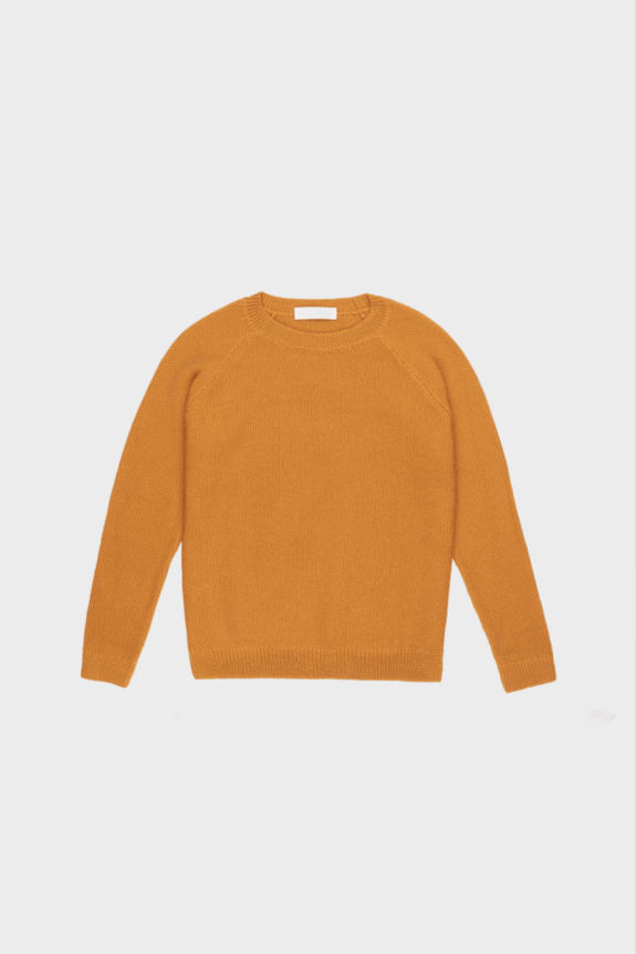 A mustard yellow knit sweater on a plain white background.