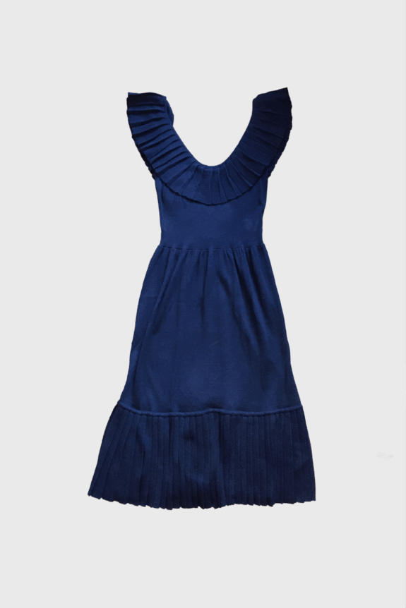 A blue dress with pleated ruffle details on the shoulders and hem.