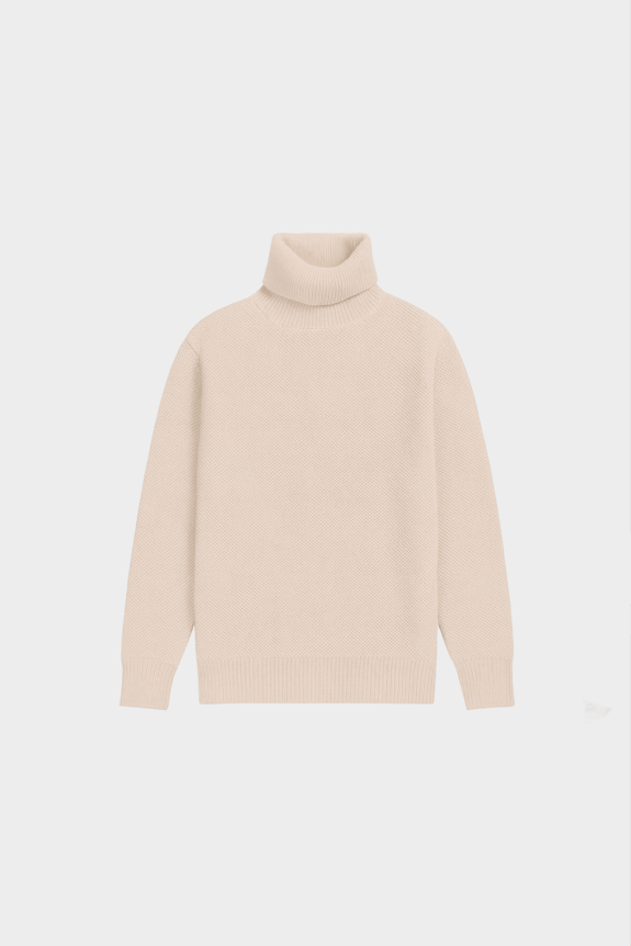 A beige turtleneck sweater displayed against a white background.