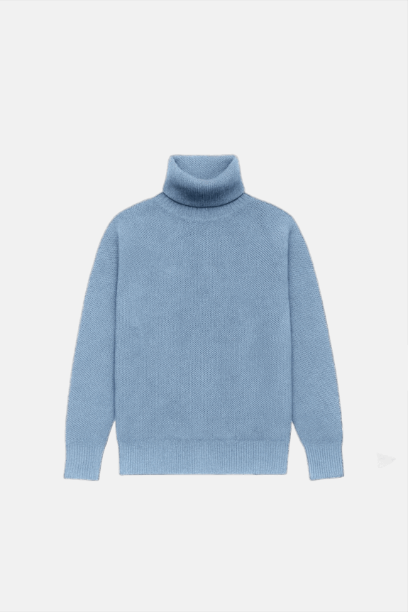 A blue turtleneck sweater with long sleeves on a plain background.