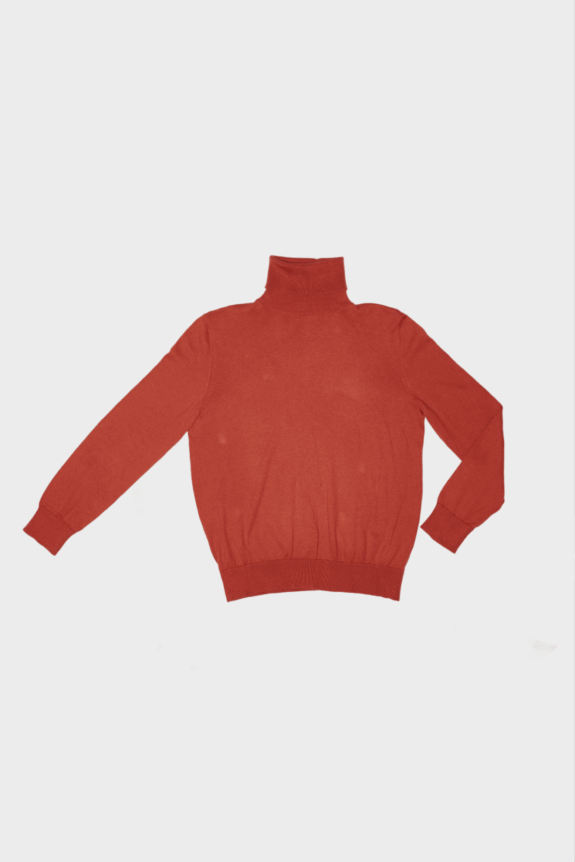 A red turtleneck sweater laid flat on a white background.