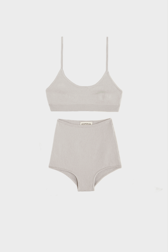 A light gray, lavender knitted bralette and high-waisted shorts set with a minimal design