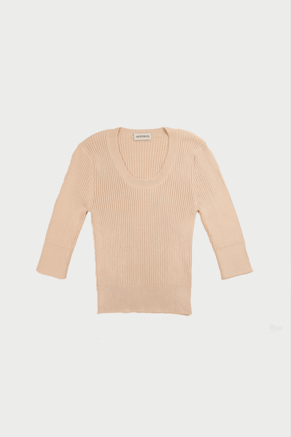 Beige ribbed sweater with long sleeves laid flat on a white background.