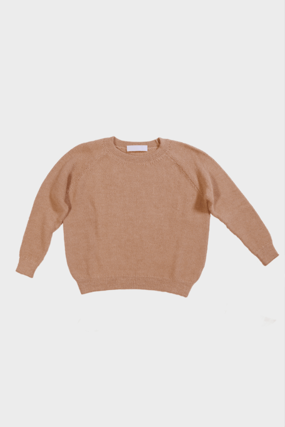 A beige knit sweater with long sleeves on a plain background.