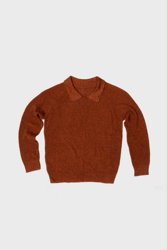 A rust-colored long-sleeve sweater with a collar on a plain background.