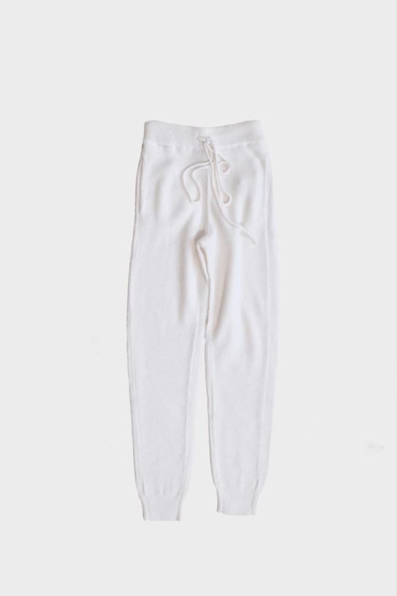 White knit joggers with a drawstring waistband.