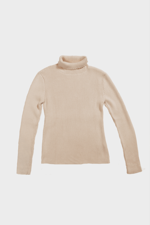 A beige ribbed turtleneck sweater on a plain background.